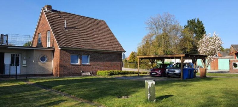 Wittmund ObjNr:B-18682 - Charmante Doppelhaushälfte mit großem Grundstück und Carport Haus kaufen