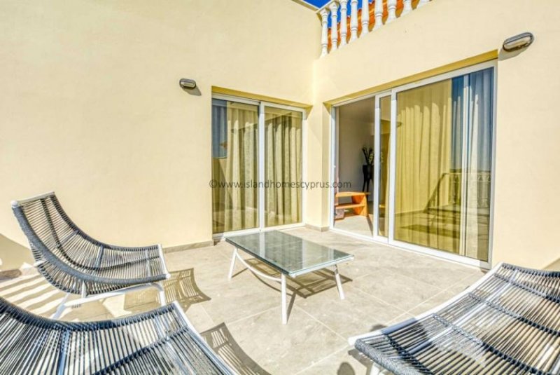 Kapparis 2 bedroom, 1 bathroom apartment in Kapparis - THE128AS.Set on a popular development with inviting communal swimming pool this