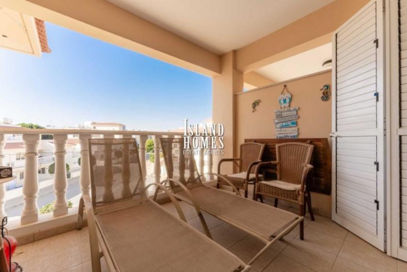 Kapparis 3 bedroom, second floor apartment with TITLE DEEDS on popular complex with two communal swimming pools in great location of -