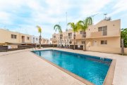 Deryneia 2 bedroom, 1st floor apartment with 24m2 veranda communal swimming pool and TITLE DEEDS ready to transfer on popular complex in