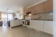 Kapparis 3 bedroom, second floor apartment with TITLE DEEDS on popular complex with two communal swimming pools in great location of -